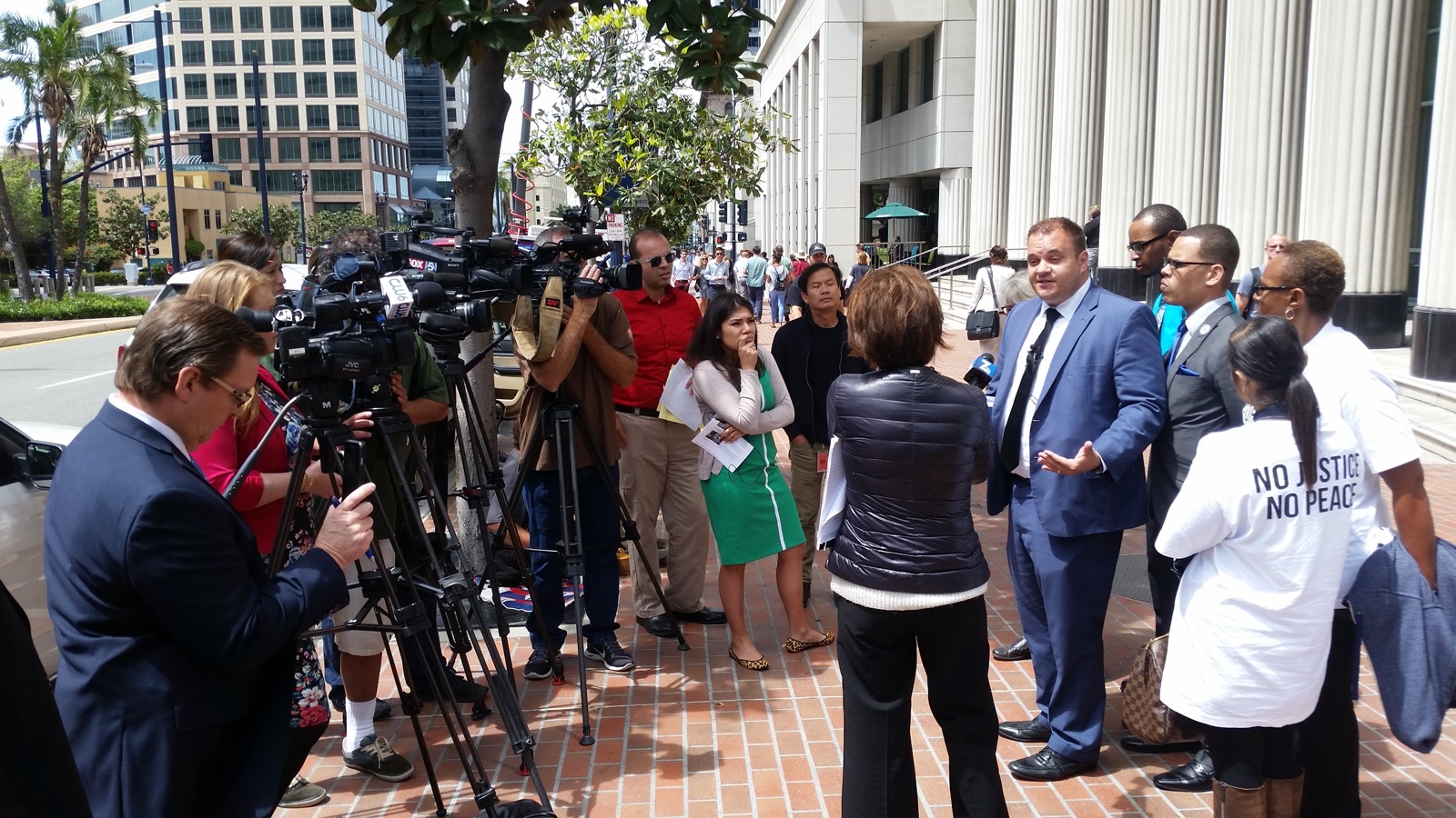 San Diego criminal defense attorney Marc Kohnen speaking to reporters at a courthouse press conference